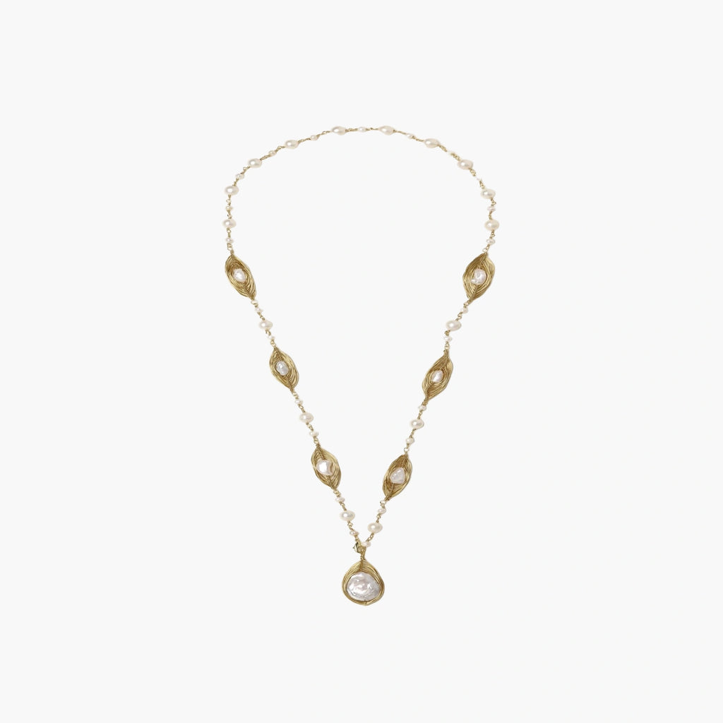 14K gold plated necklace with organic leaf motifs and freshwater pearls arranged in an elegant chain design on neutral background.