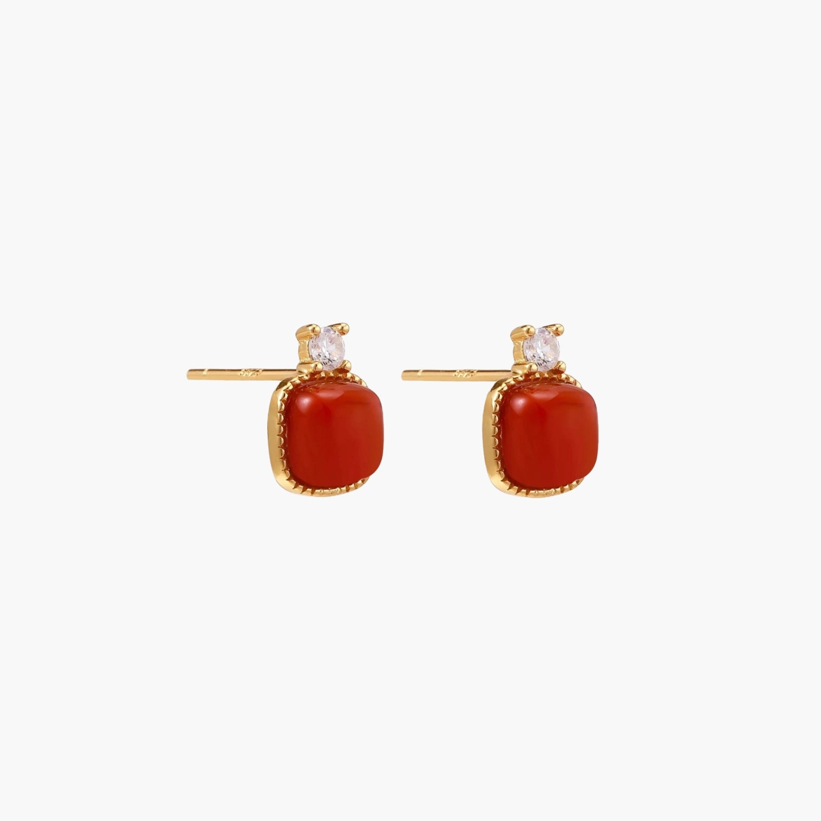 18K gold vermeil stud earrings with cushion-cut red agate stones and sparkling crystal accents on beige background