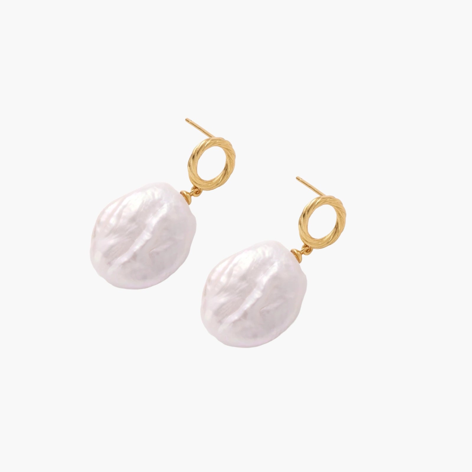 18K gold vermeil twisted circle studs with organic white baroque pearl drops on cream background