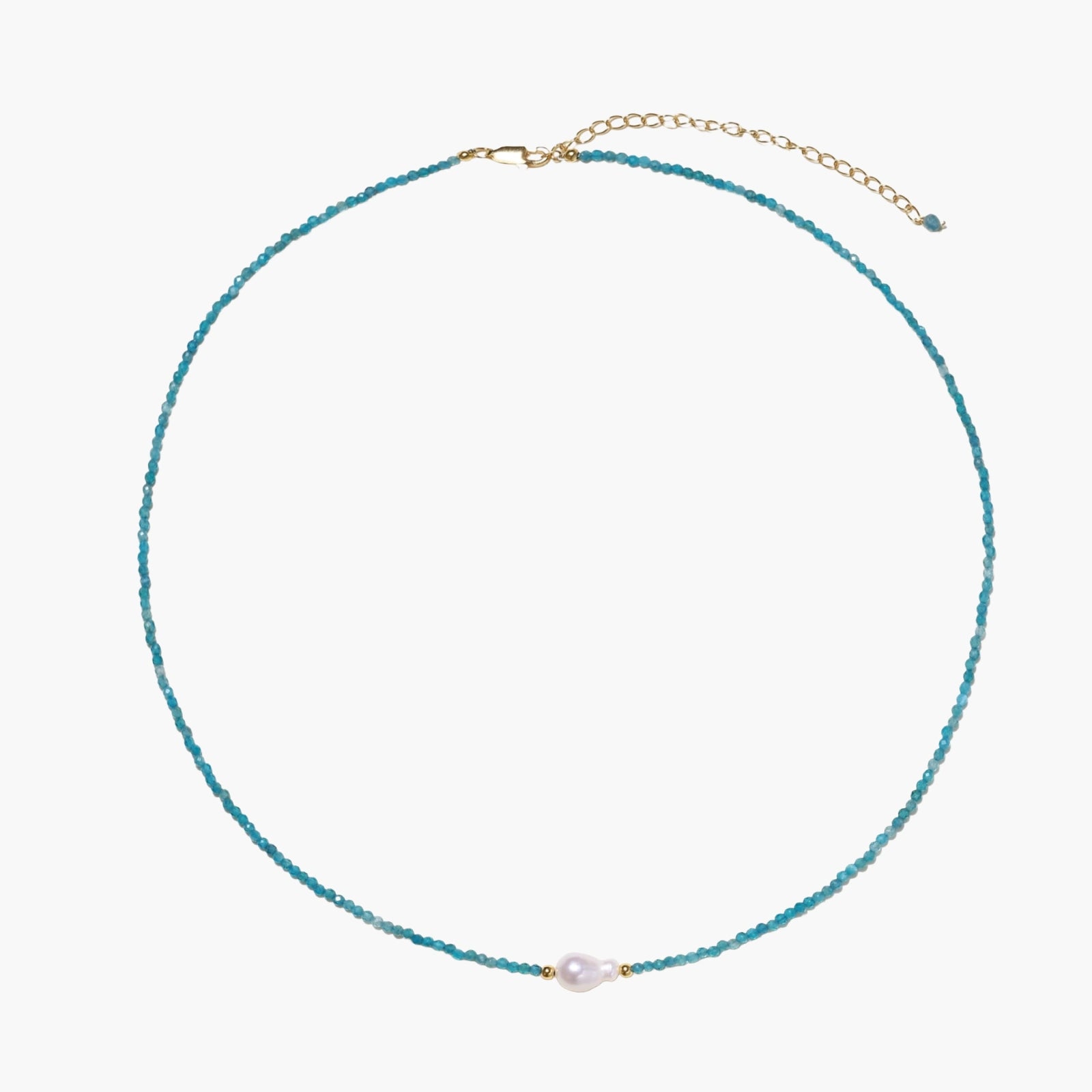 Delicate gold vermeil necklace with teal apatite beads and freshwater pearl on white background.