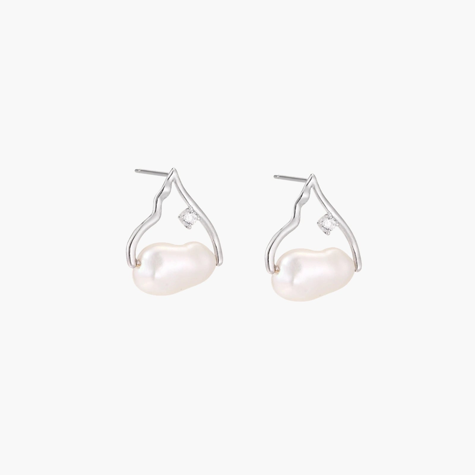 Silver mountain outline studs with baroque pearl and diamond accent on white background
