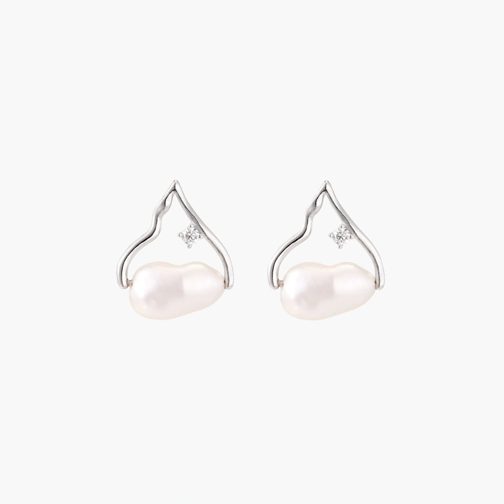 Silver mountain outline studs with baroque pearl and diamond accent on white background