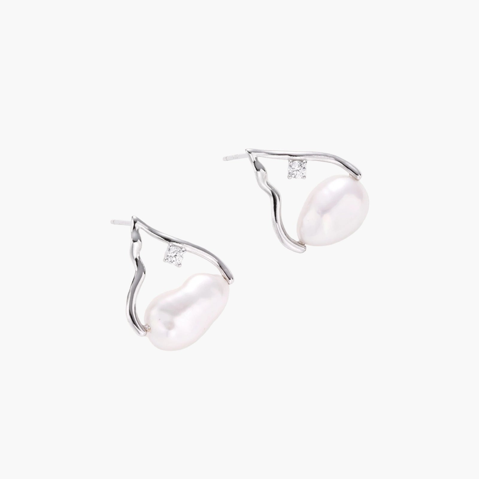 Silver mountain outline studs with baroque pearl and diamond accent on white background