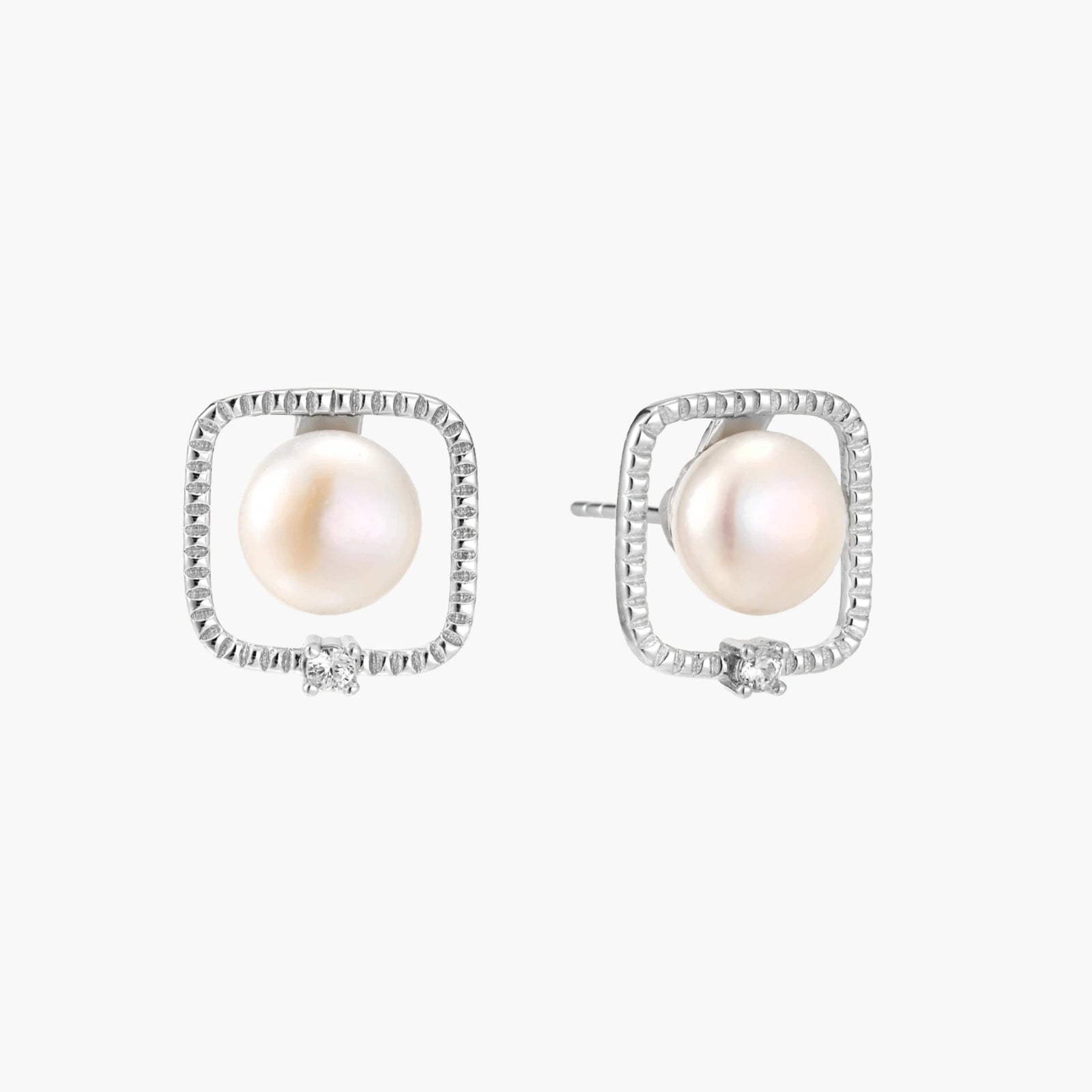 Rhodium-plated silver stud earrings with cushion frame, centered freshwater pearl, and tiny crystal accent