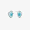 Oval larimar gemstone studs with ornate silver settings showing natural turquoise marbling on cream background