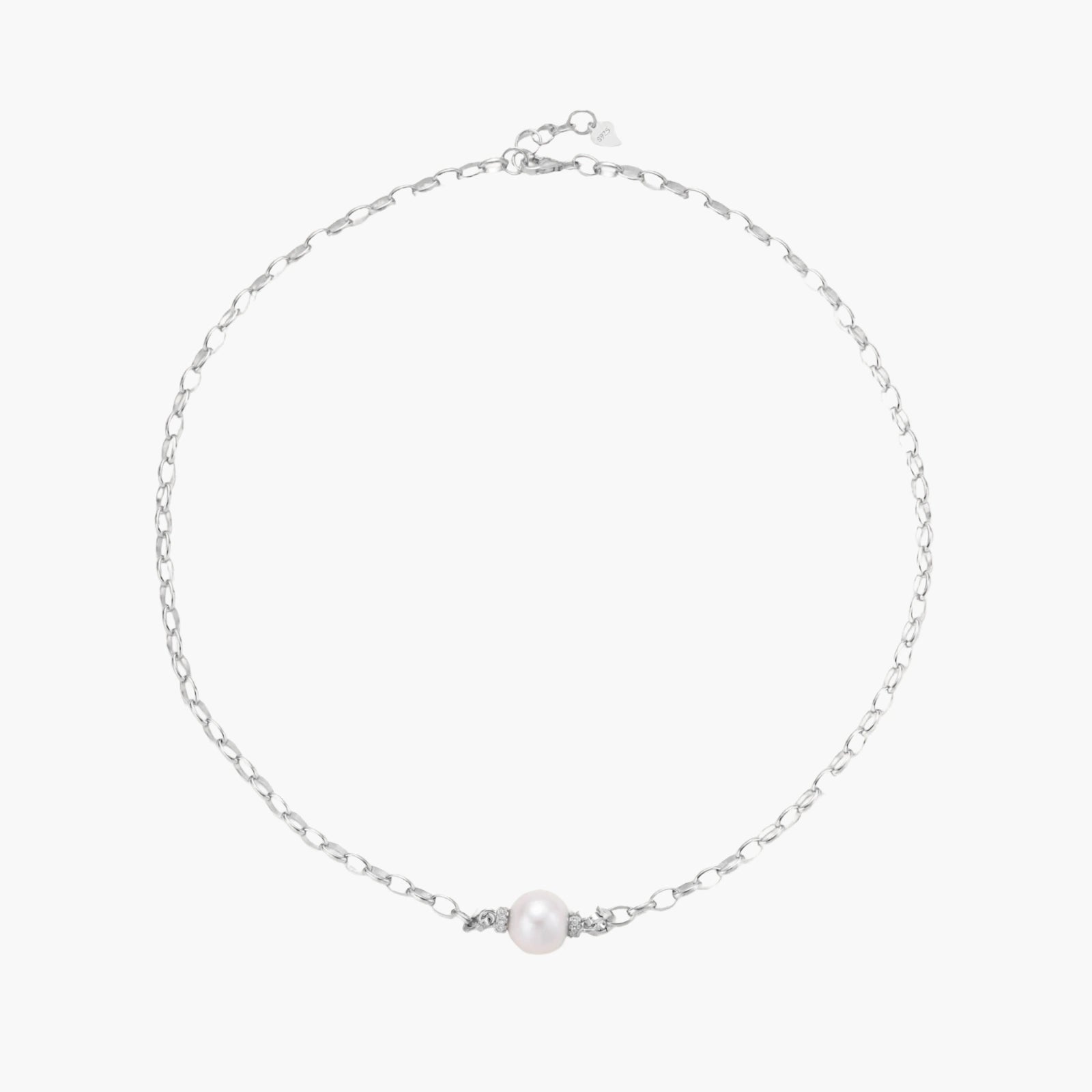 Dainty rhodium-plated silver chain necklace with centered 10mm freshwater pearl and crystal accents on cream background