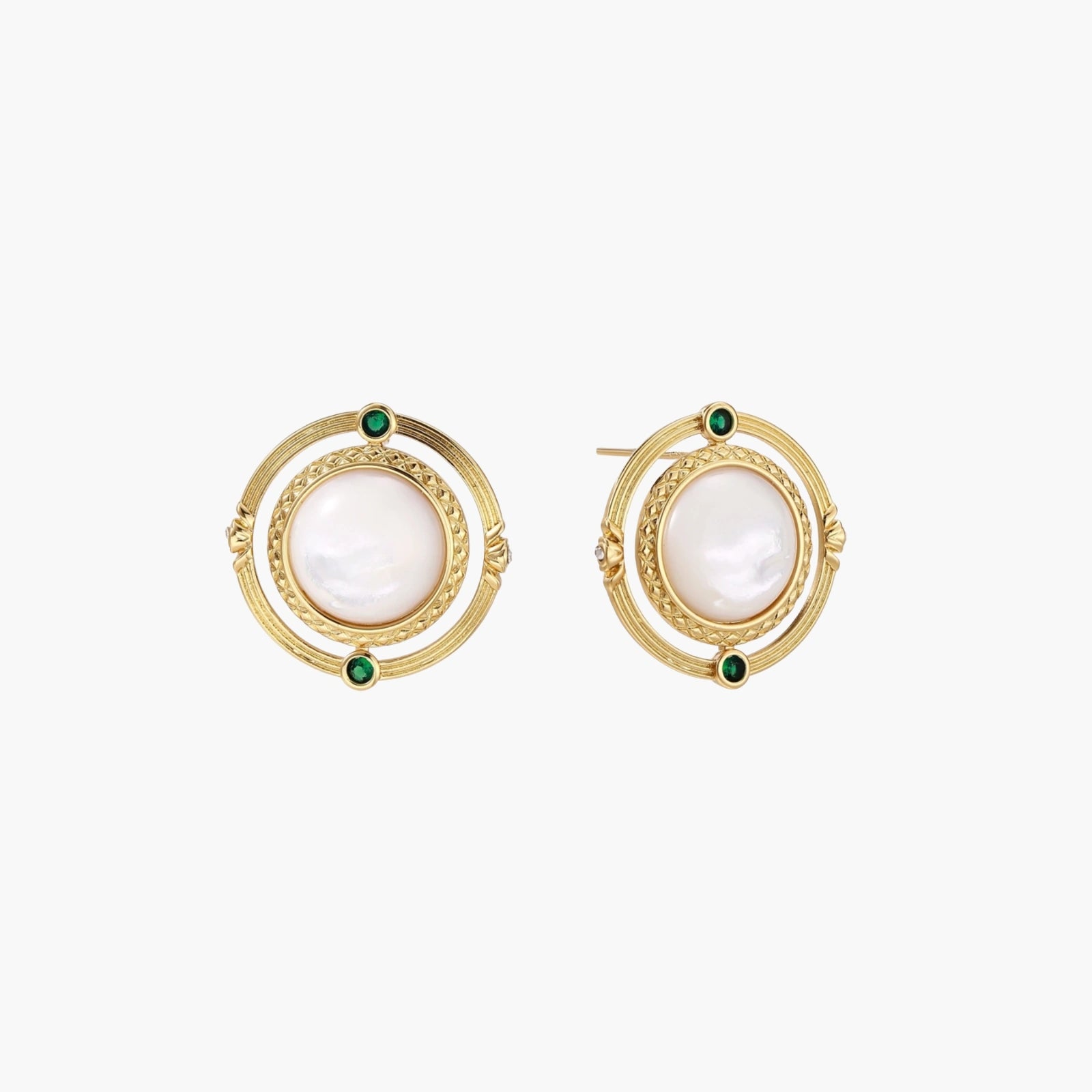 Circular gold stud earrings with iridescent mother-of-pearl center and green zirconia accents on cream background.