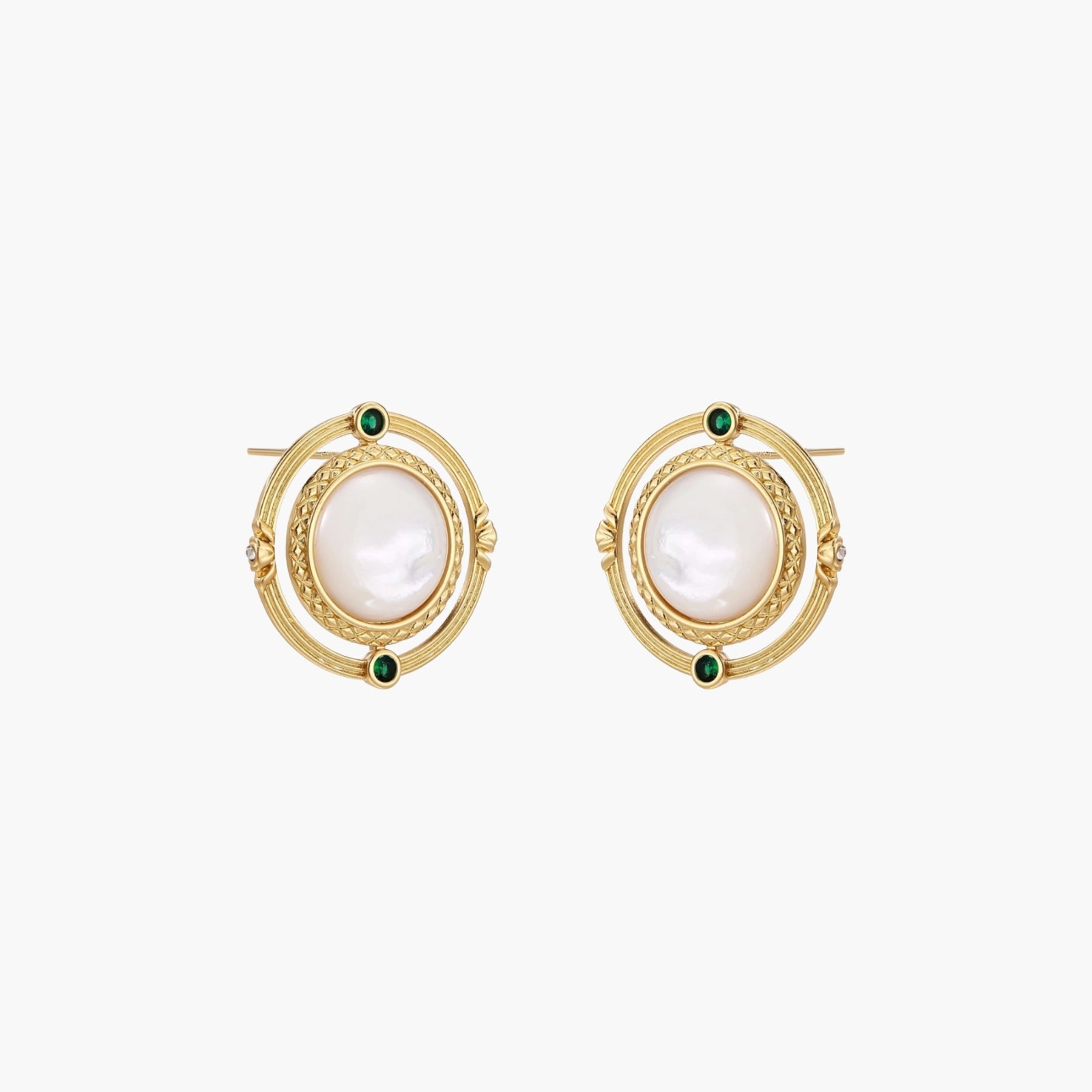 Circular gold stud earrings with iridescent mother-of-pearl center and green zirconia accents on cream background.