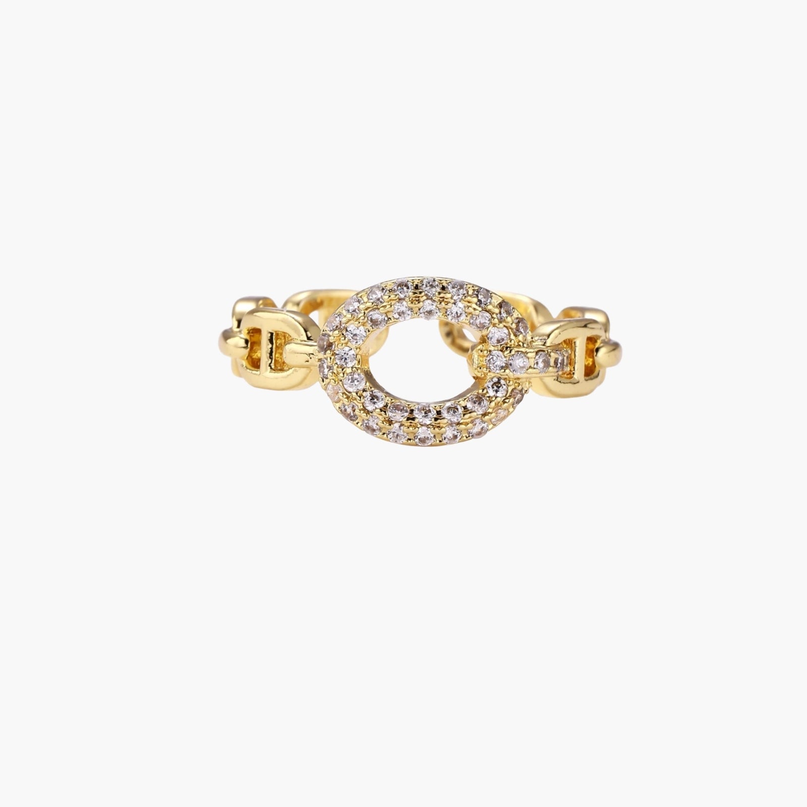 Gold-plated brass chain link ring with one oval CZ-pavé segment on cream background, adjustable cuff style.